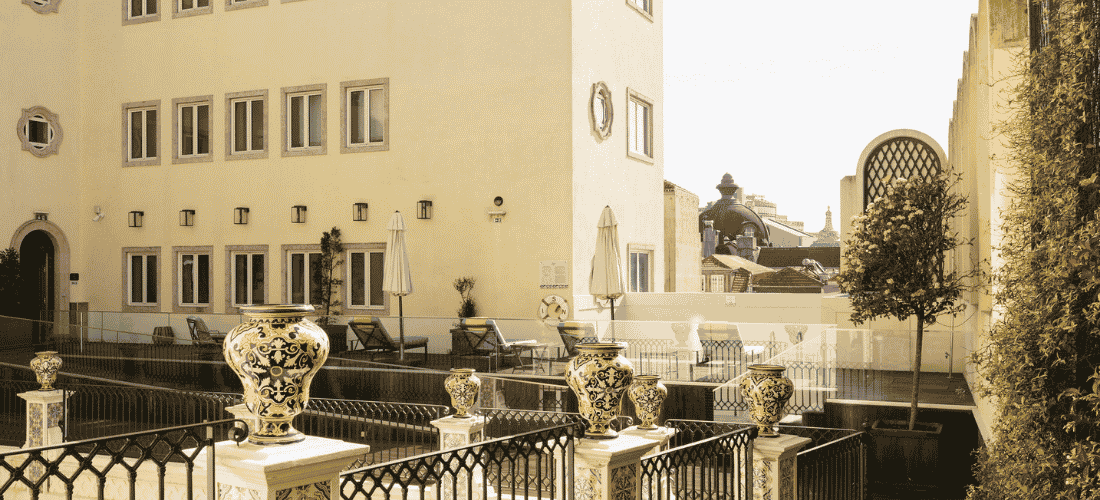 Luxury building terrace with decorative vases and historic architecture