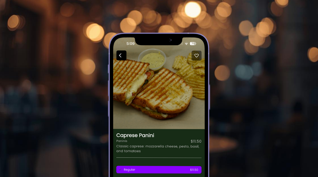 Smartphone screen displaying a food app with a grilled Caprese Panini sandwich, chips, and sauce, priced at $11.50.