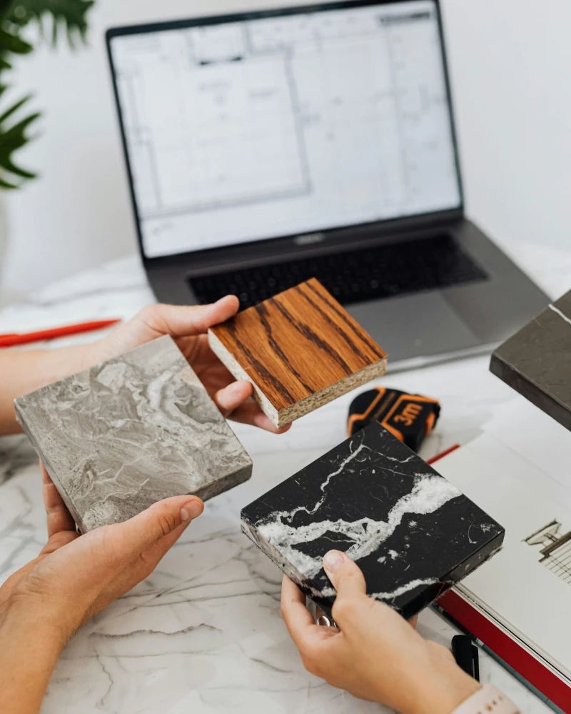 People Holding Tile Samples