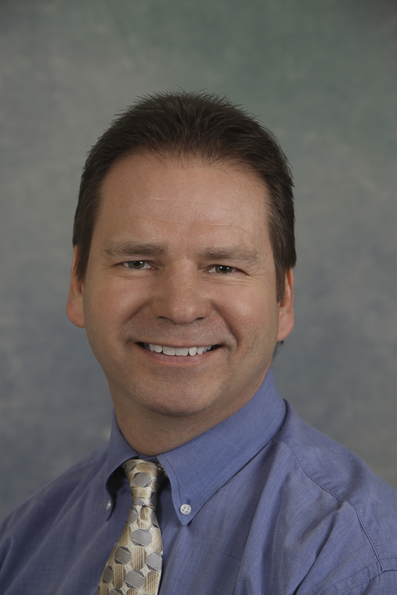 Mike_picture profile blue shirt.jpg