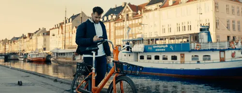 Man on phone with a bike