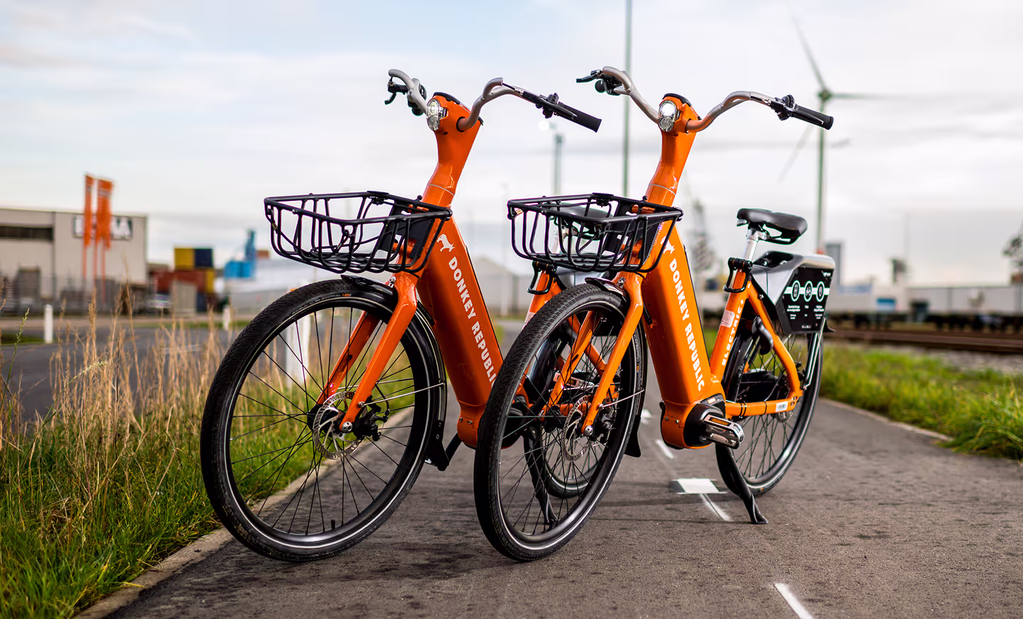donkey republic bikes parked on the side of road