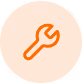 A wrench in a circle with an orange stroke.