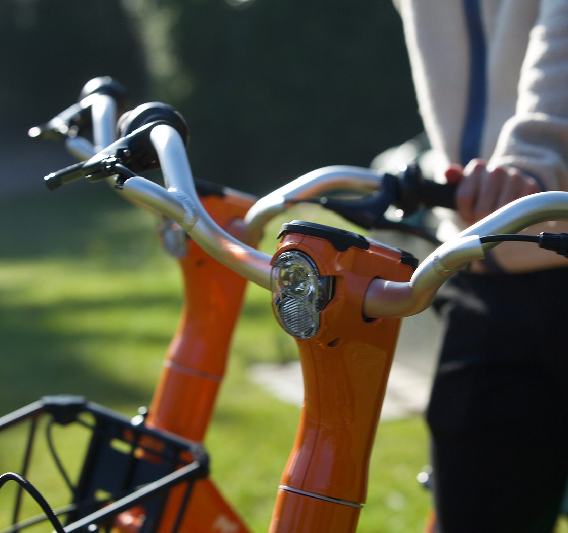 A close up of a person riding a bike.