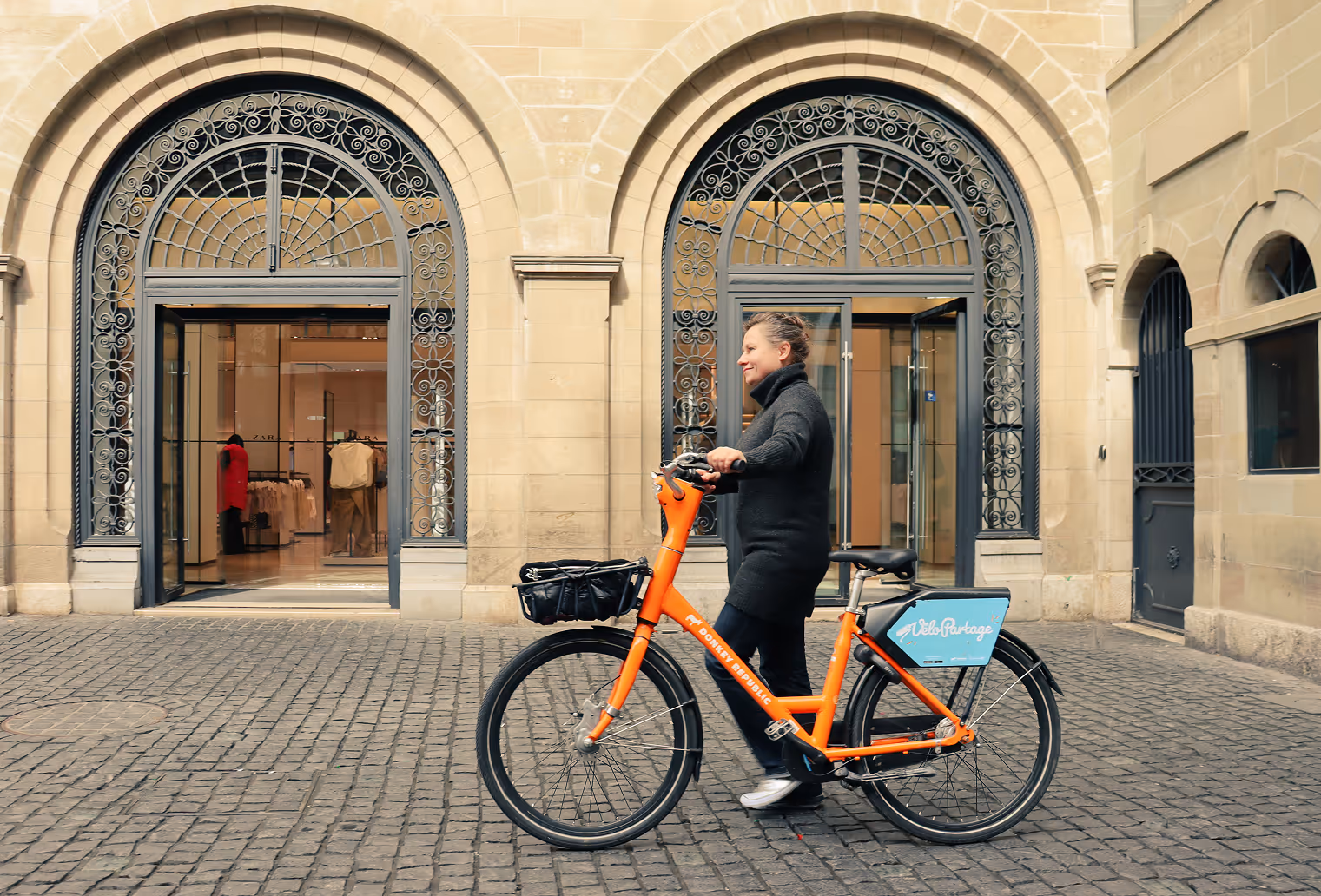 Man and an orange bike