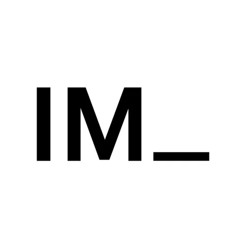 A black and white photo of the letter IM