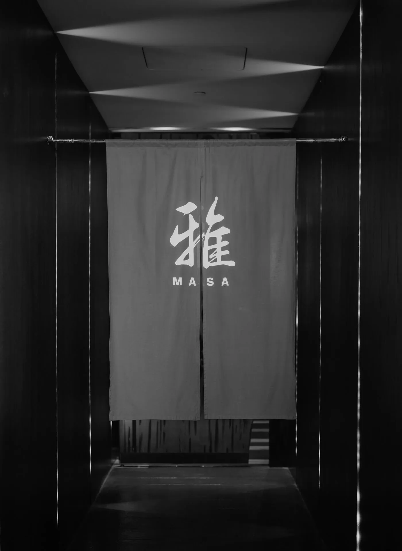 Monotone image of the entrance curtains at Masa restaurant