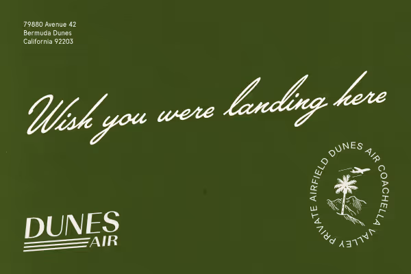 Dunes Air Green postcard with white text reading 'Wish you were landing here'