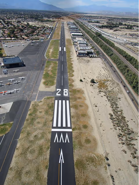 Dunes Air Runway 28 from above with the Train Tracks & Freeway to the North (right hand side)