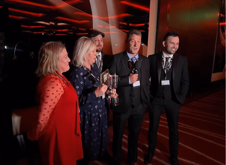 An image of the National Fish and Chip awards showing the winners being interviewed with their award.