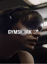Close-up of a woman wearing headphones with the text 'GYMS RK' and a play button overlay.
