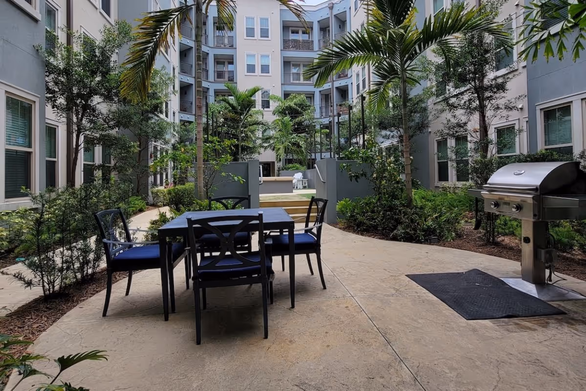 Zen courtyard with fountain and grilling area (at Novus)