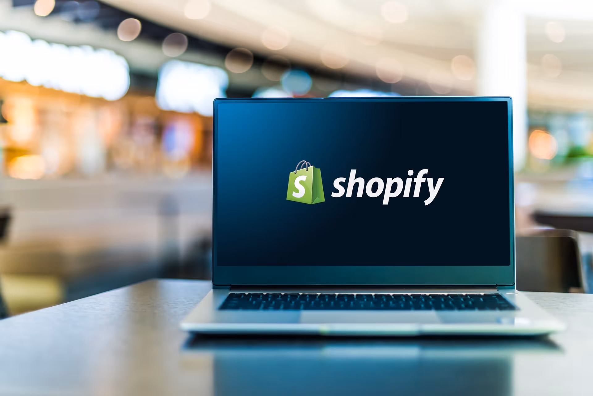 Laptop using Shopify depicting e-commerce design