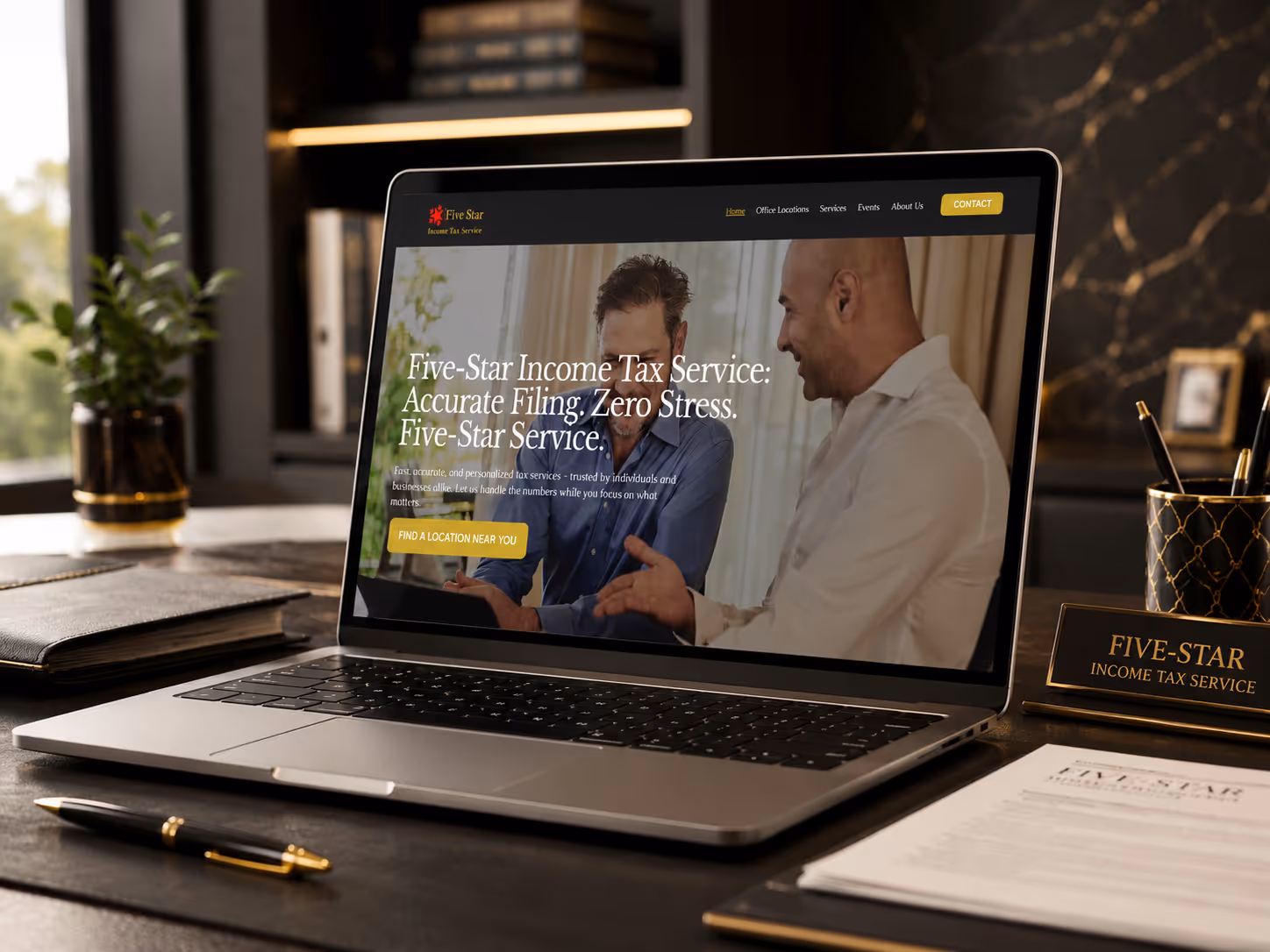 Laptop open on website design of tax consultant homepage sitting on desk