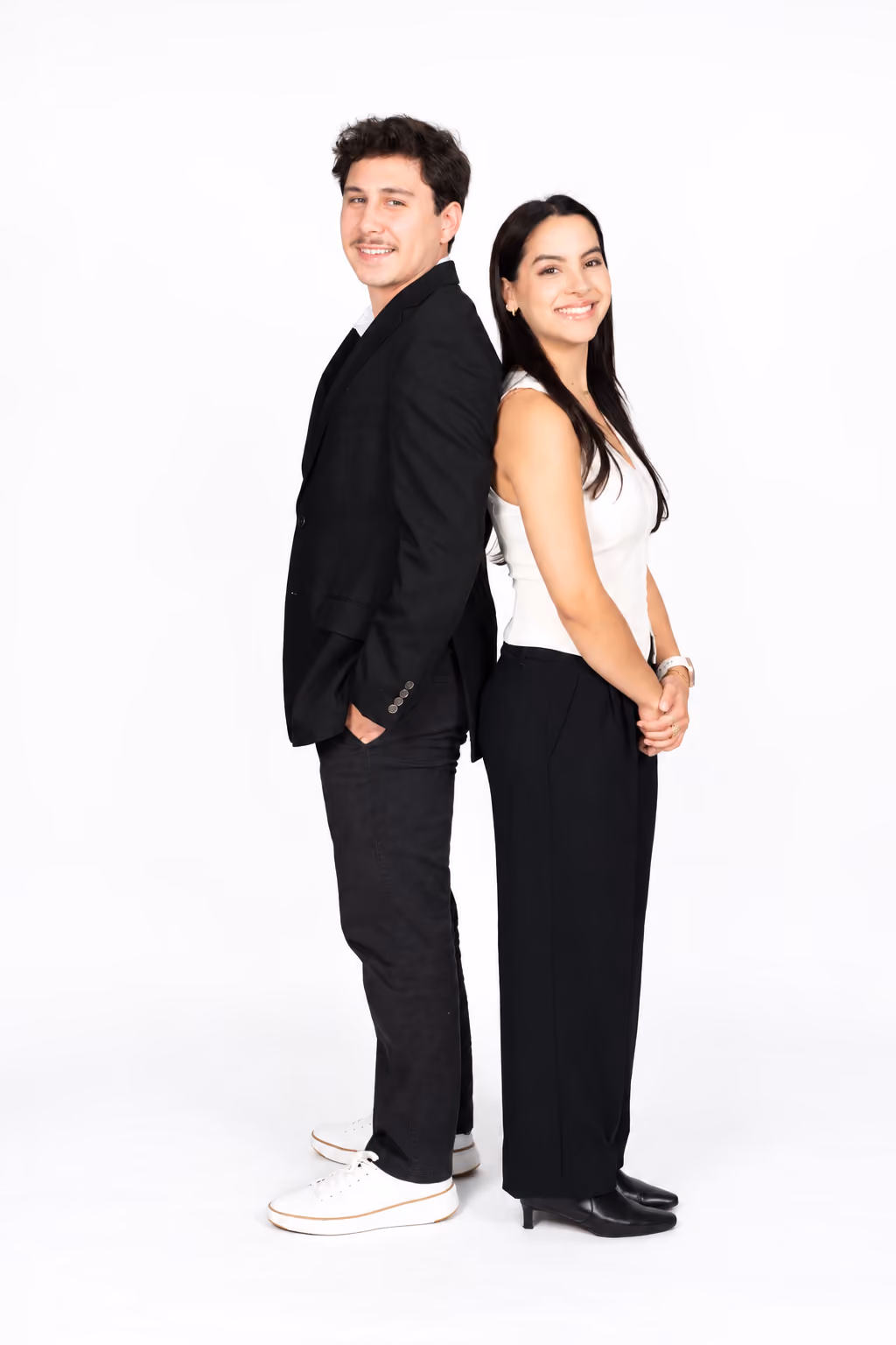 Jason Tello and LuzMarie Garcia, the co-founders of Social Reach Co, standing back to back