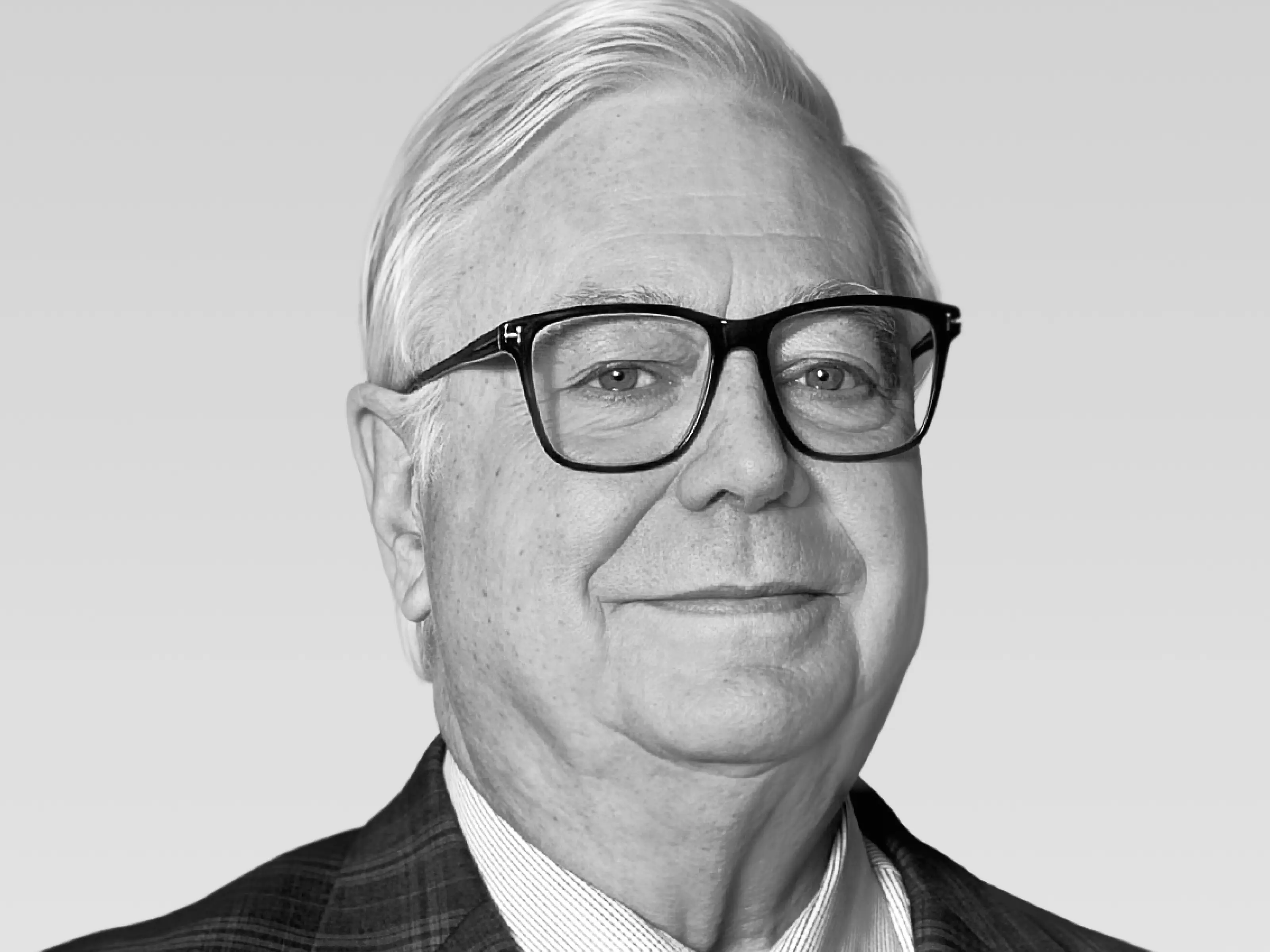 Black and white headshot of a woman with long straight hair, wearing a single dangling earring and a blazer, smiling slightly.