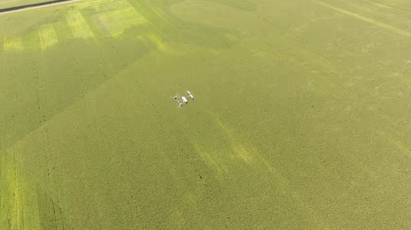A DJI Inspire 1 on a mapping mission above a field