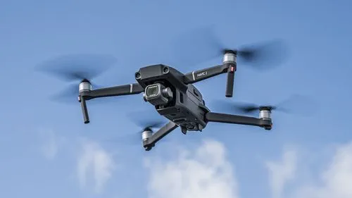 A DJI Mavic 2 drone in the clouds.