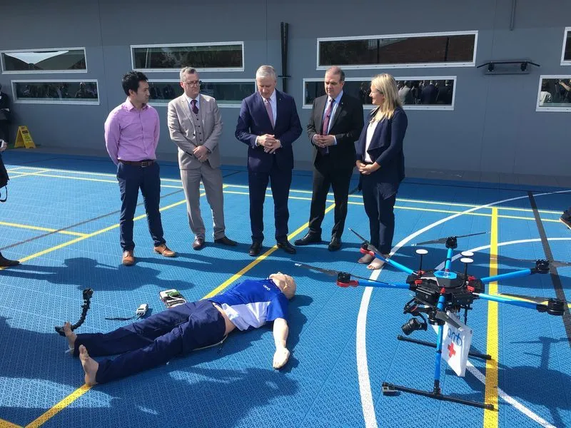 Jackie presents to group of potential users with a drone and rescue dummy