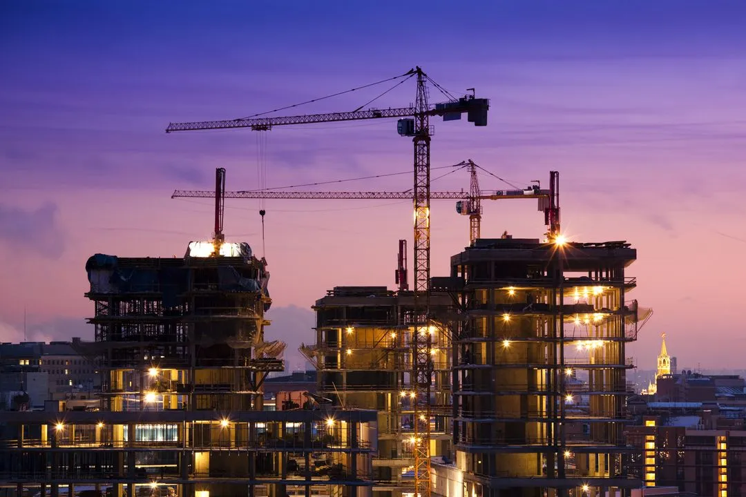 skyline under construction at sunset