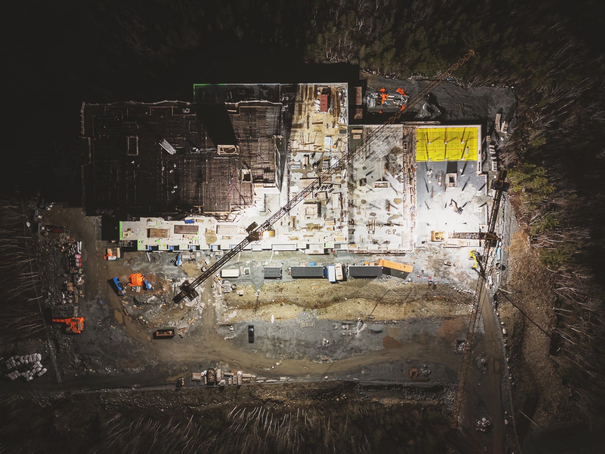 drone footage of a construction site at night