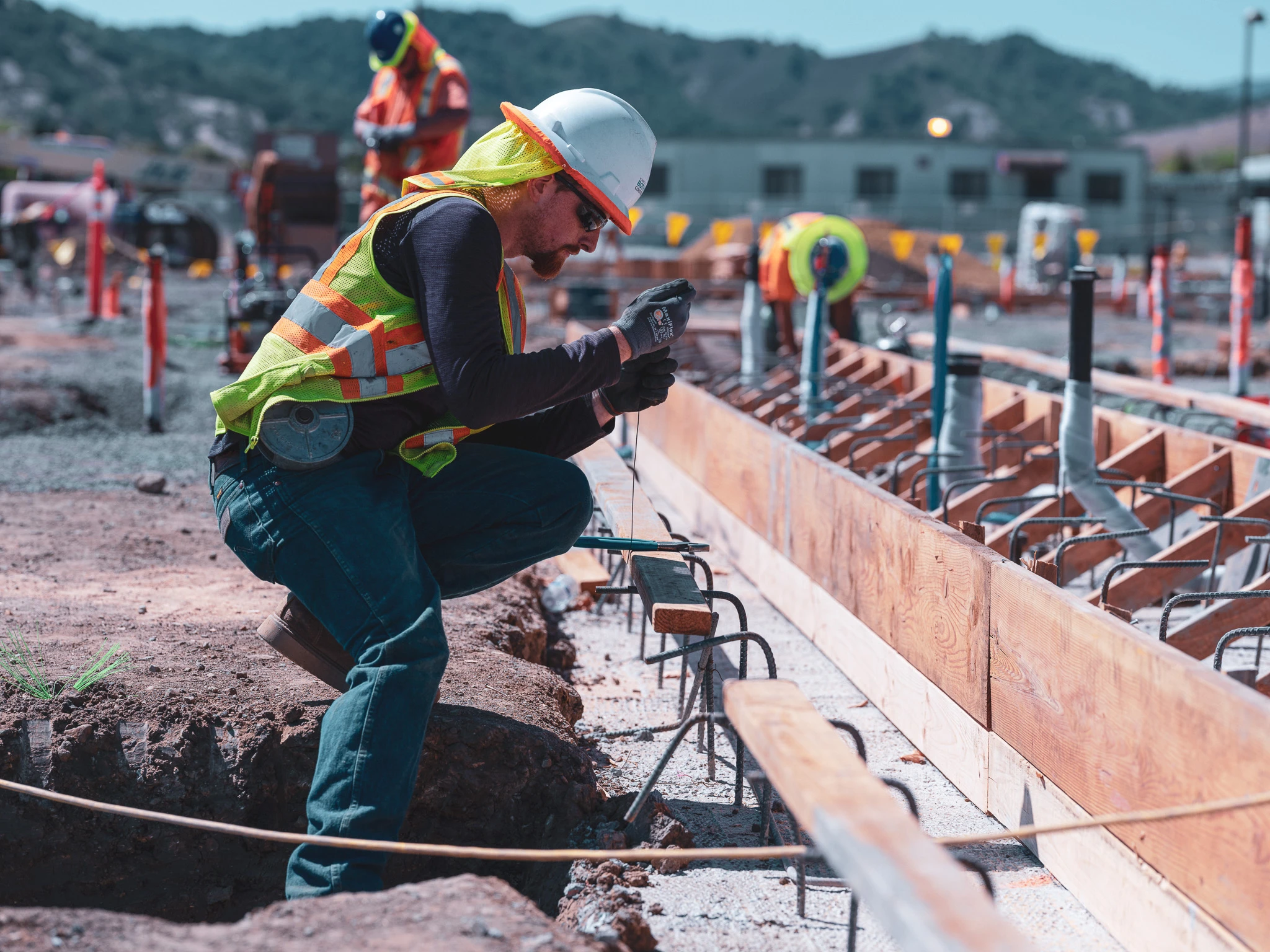 construction worker taking a photo on site