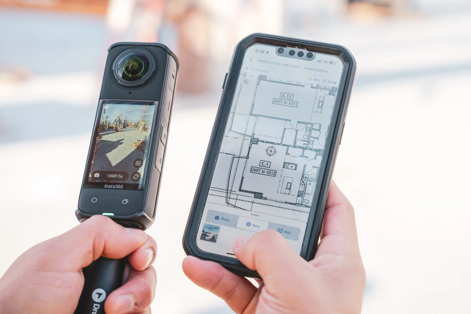 over the shoulder of someone using a phone and a 360 camera