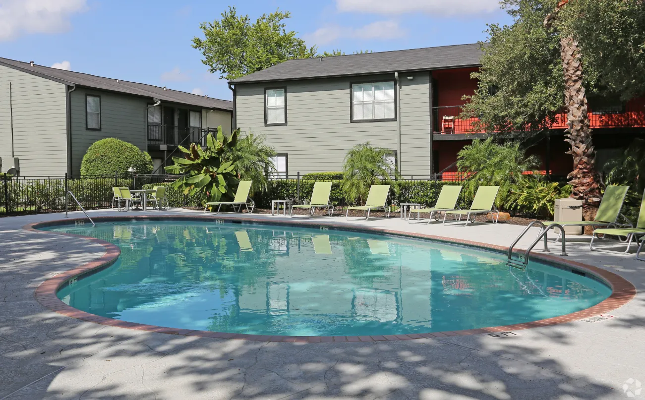 swimming pool with lounge chairs