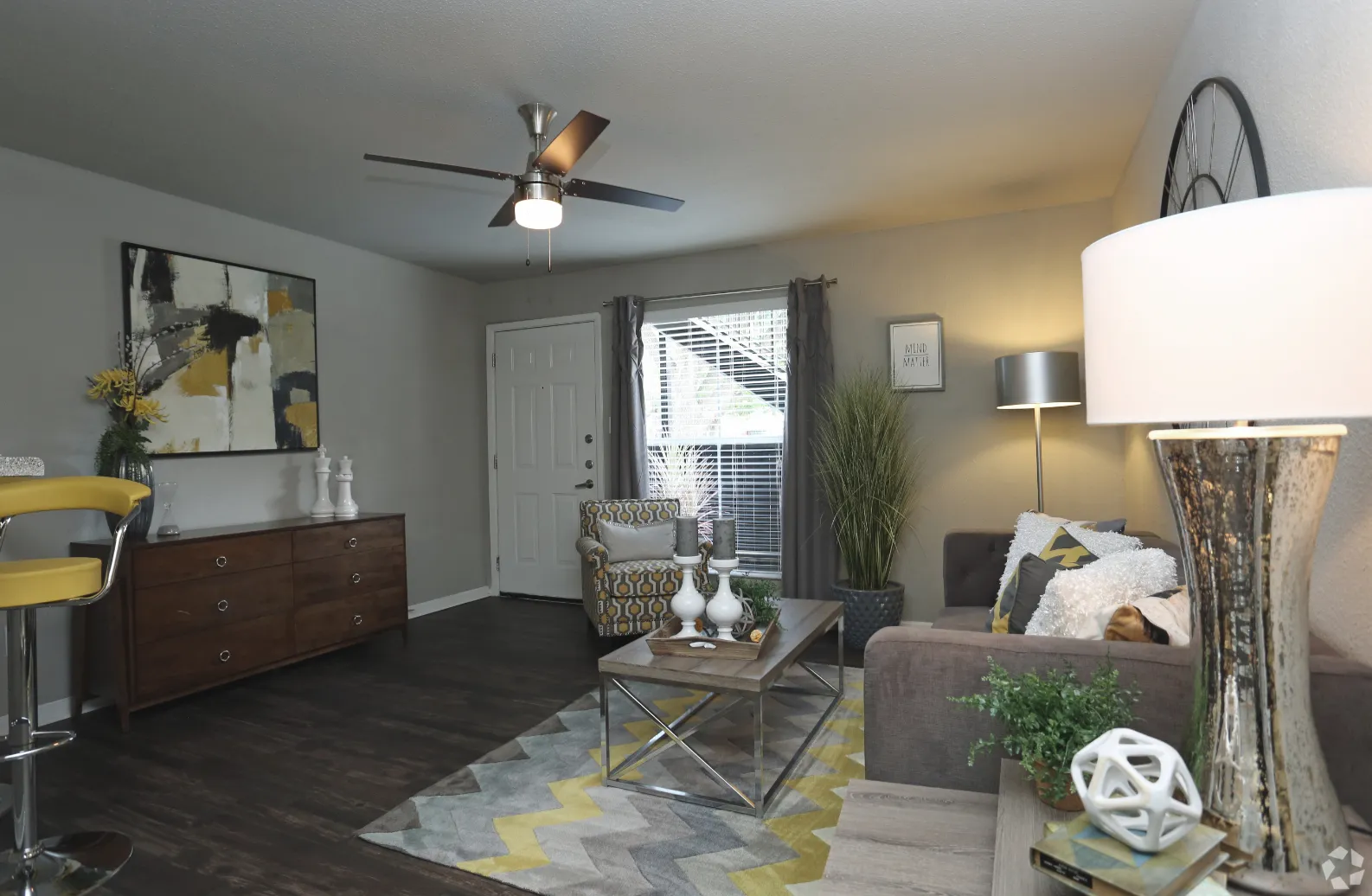 furnished living area with view of entry door