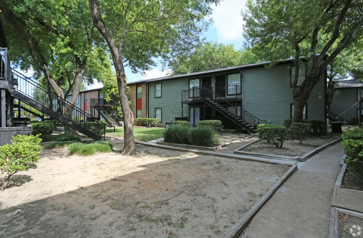 exterior with walking path and trees