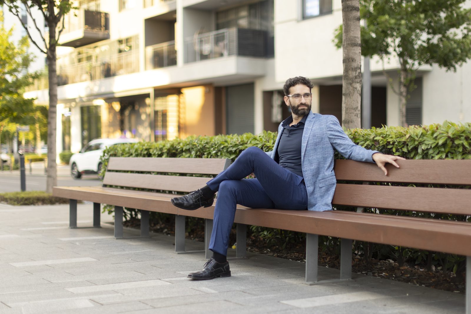 Miroslav Ćurčić sitting on a bench outdoors