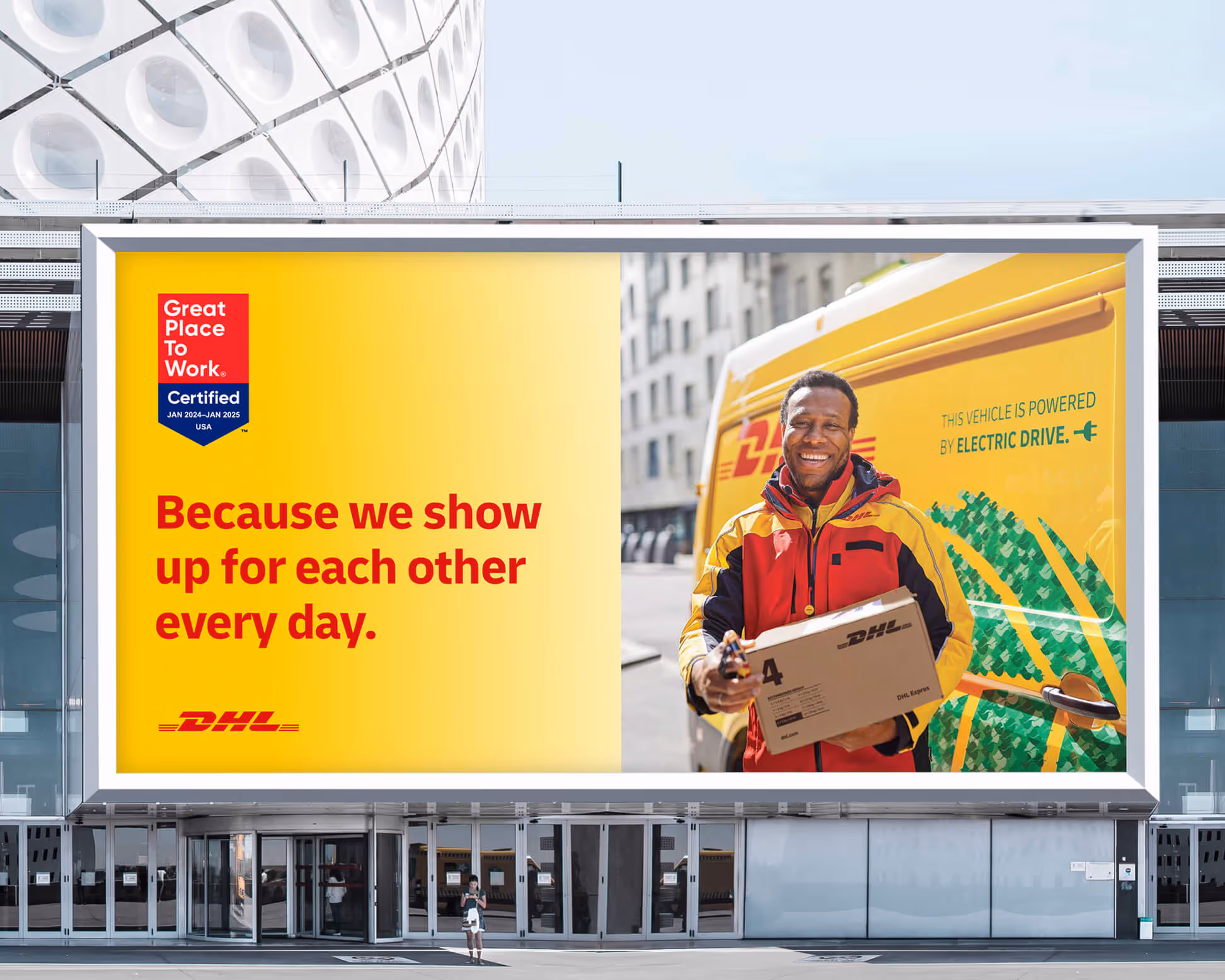 Billboard shows DHL courier holding a package by an electric delivery van with text about care and a Great Place To Work Certification badge.