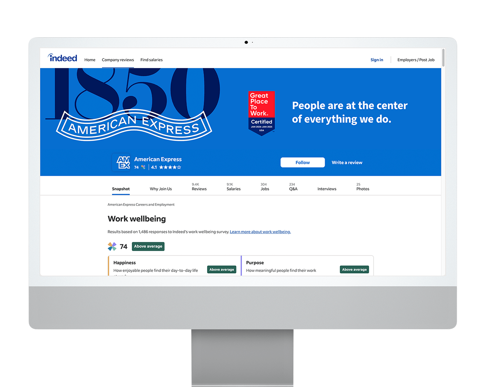 A desktop computer showing an Indeed company profile page for American Express displaying ratings and a Great Place To Work Certification badge.