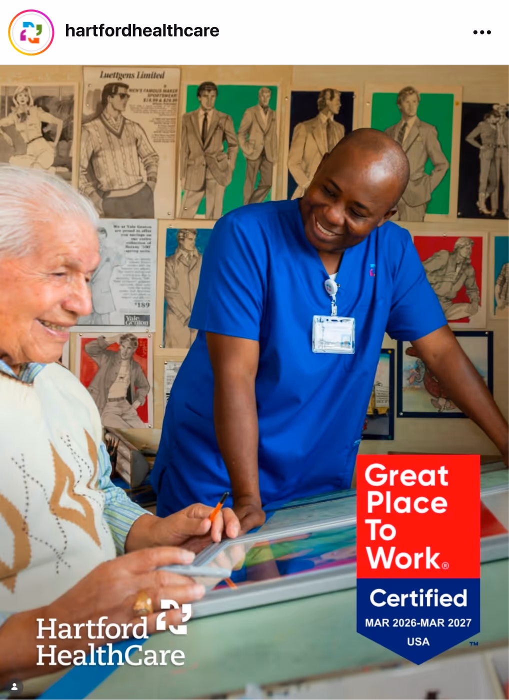 Healthcare setting with staff and a patient interacting at a counter, overlaid with a Great Place To Work Certification badge.