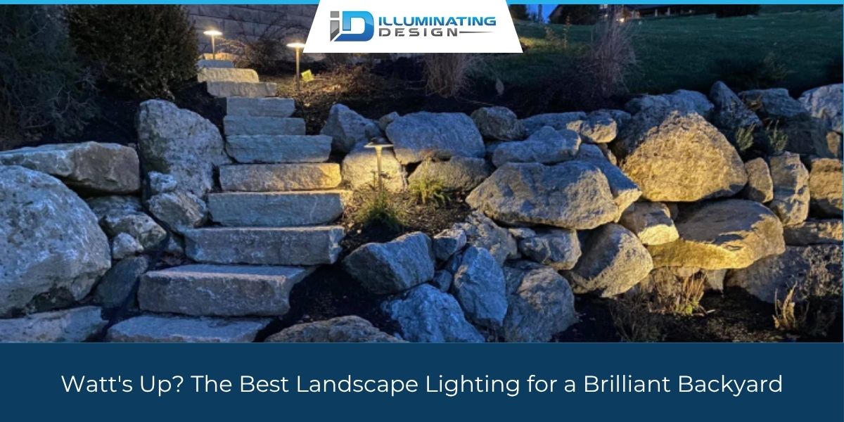 Well-lit stone pathway with backyard landscape lighting illuminating the steps and surrounding rocks.