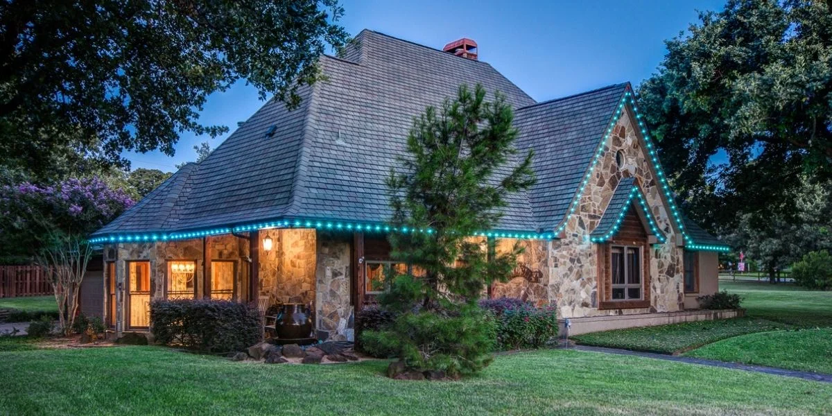 user-inserted Modern house exterior architectural lighting with uplighting and trim lights.