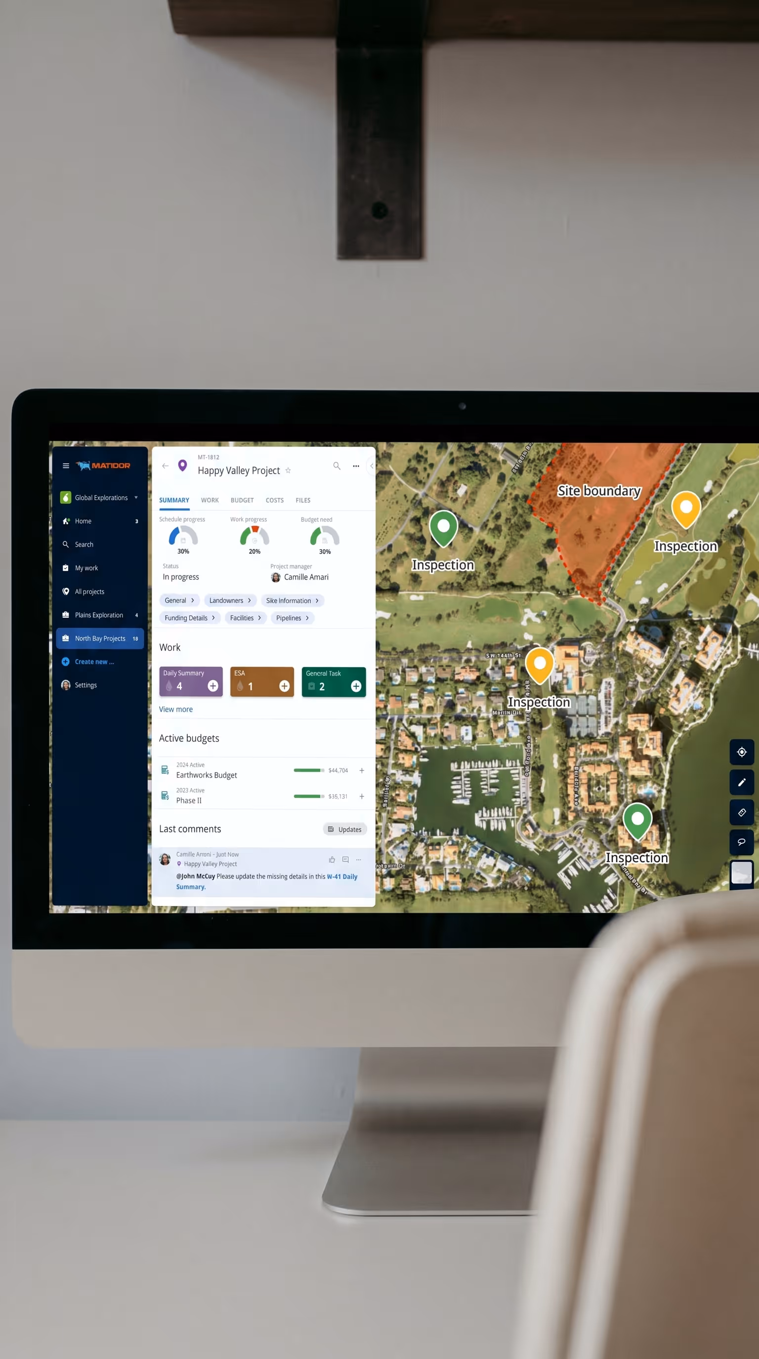 Matidor platform on a desktop monitor showing a GIS map with project pins and site summary panel, used by Surge Energy to visualize and sequence closure work across geographic areas