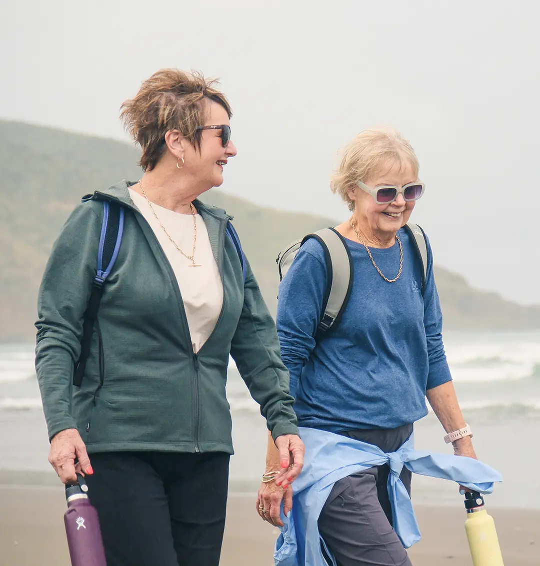 Friends enjoying a walk on the beach