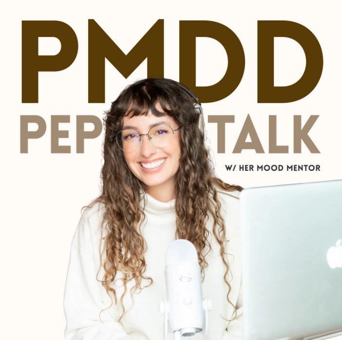 Smiling woman with curly hair and glasses speaking into a microphone with laptop, podcast title PMDD Pep Talk above her.