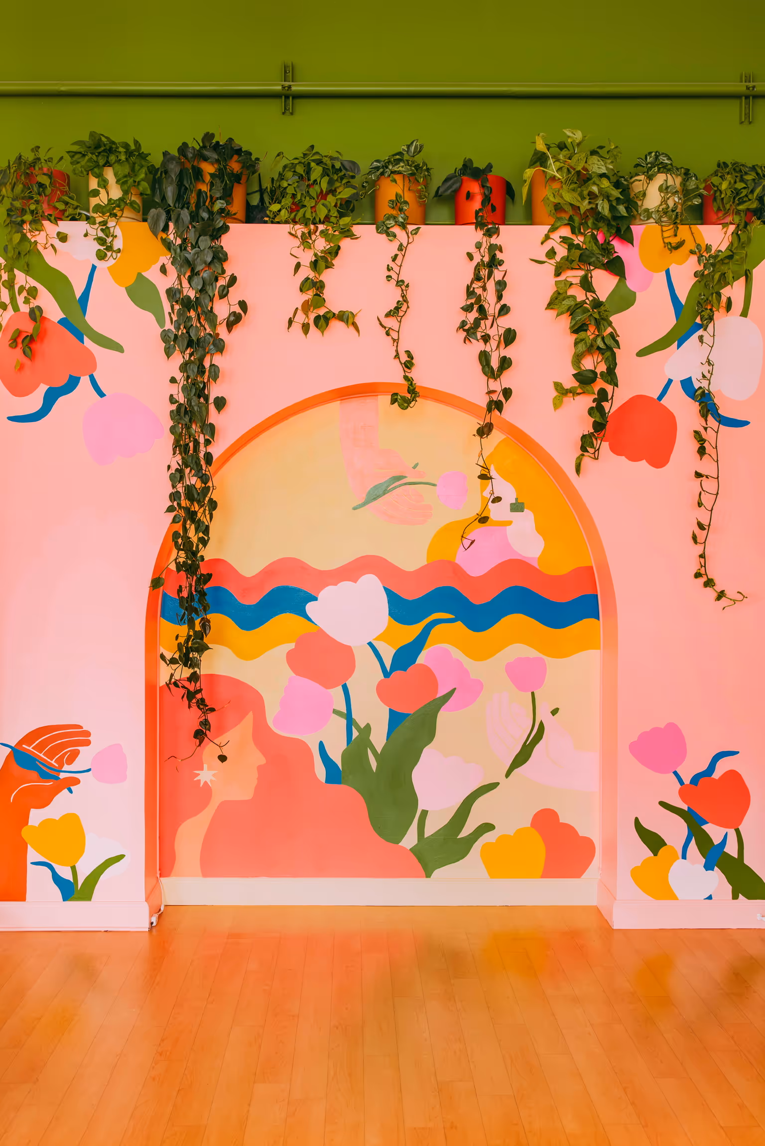 A hand painted mural in Omaha, NE by artist Allie