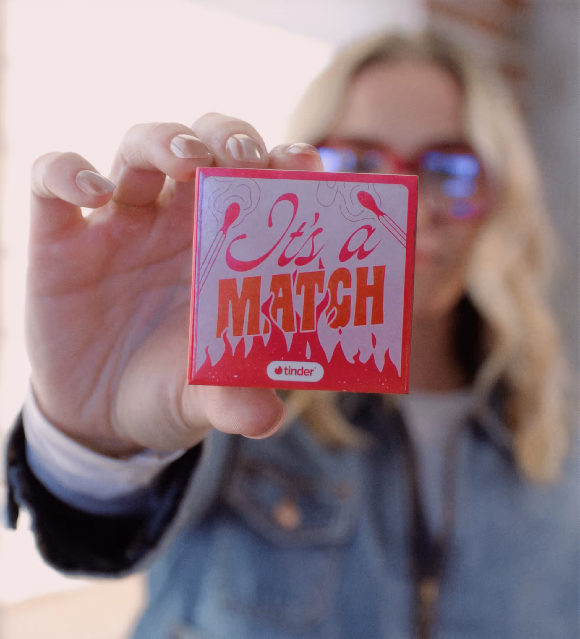 A custom designed matchbox that says "it's a match".
