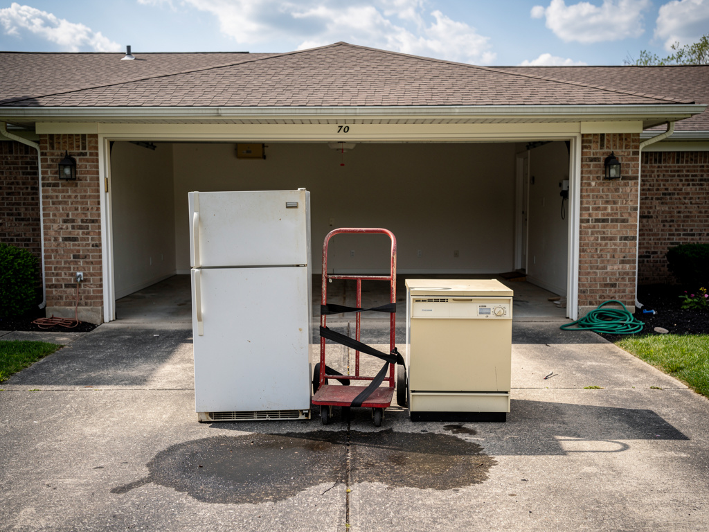 Appliances staged on driveway for removal in Columbus OH