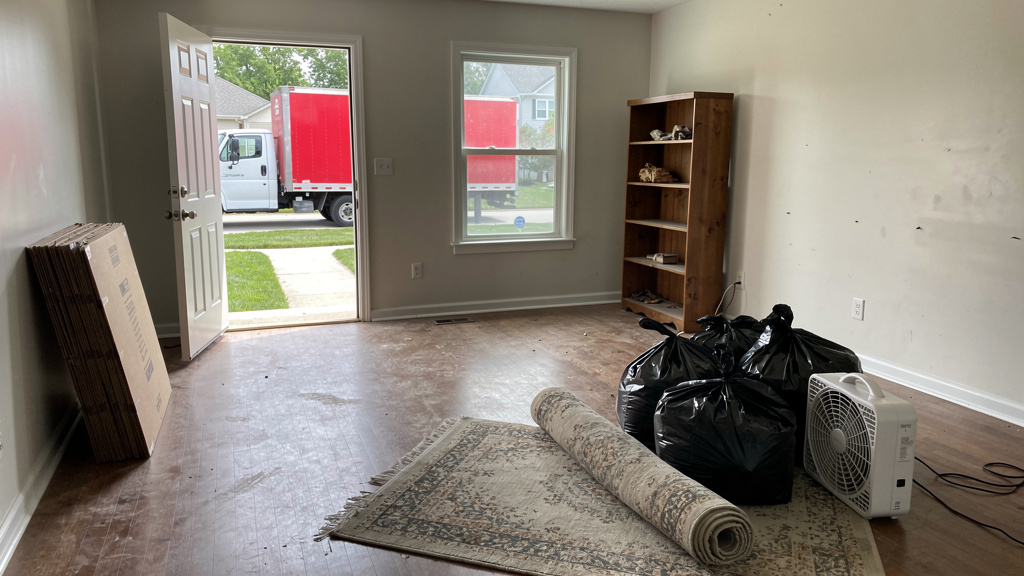 Half-empty home mid-move with items left behind for junk removal in Columbus, Ohio