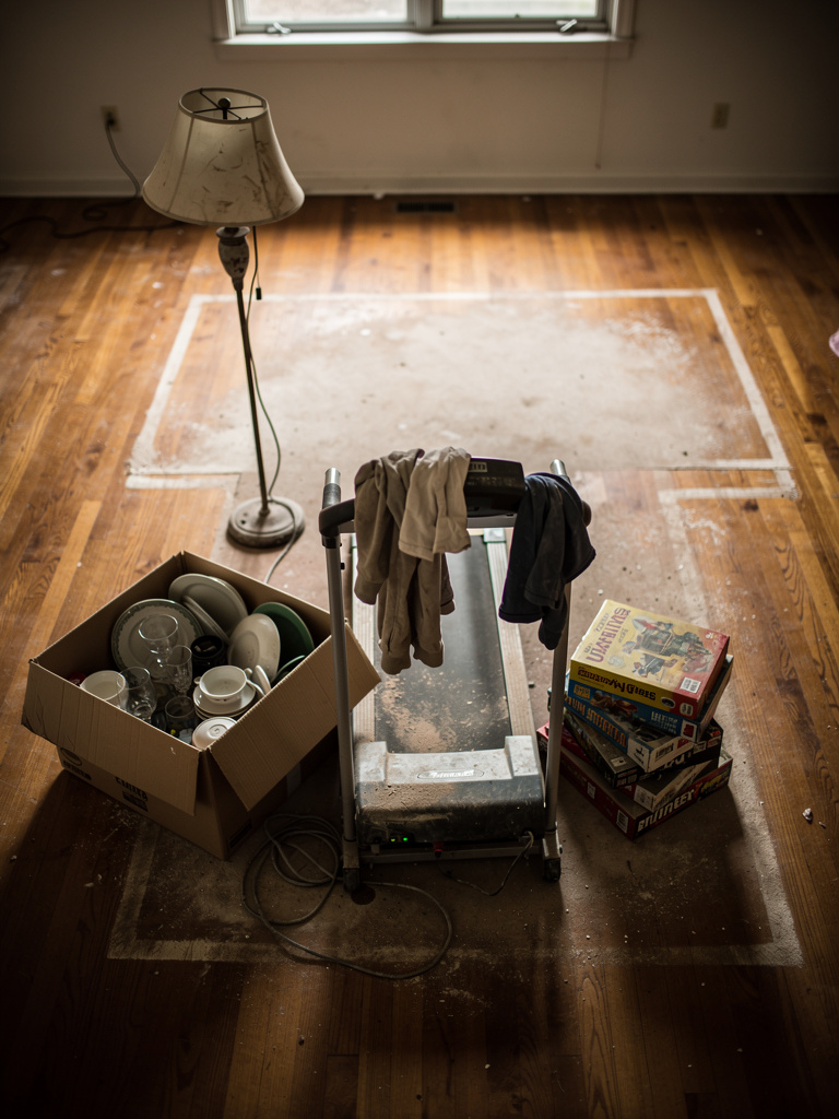 Unwanted items on hardwood floor that won't be making the move