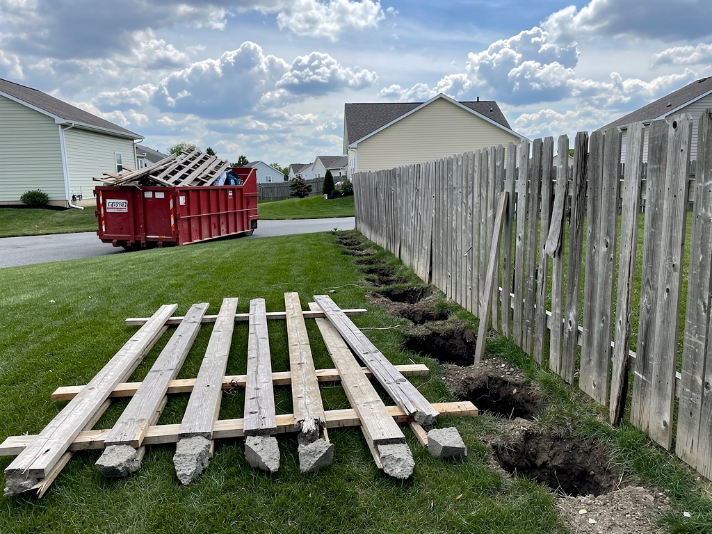 Fence removal in progress along property boundary