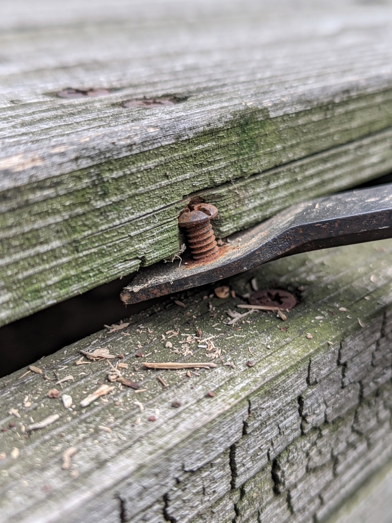 Demolition tools and deck debris close-up