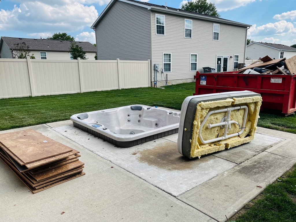Hot tub being broken down for removal