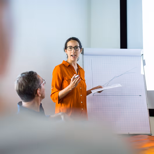 Consultant at an engineering firm discussing pipe inspection data