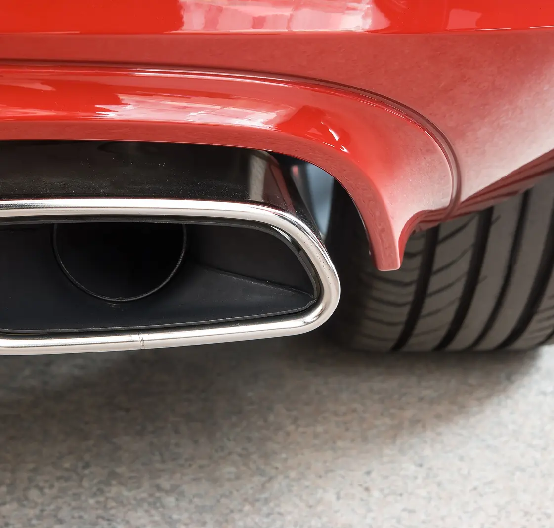 Close up view of a sports car tailpipe. 