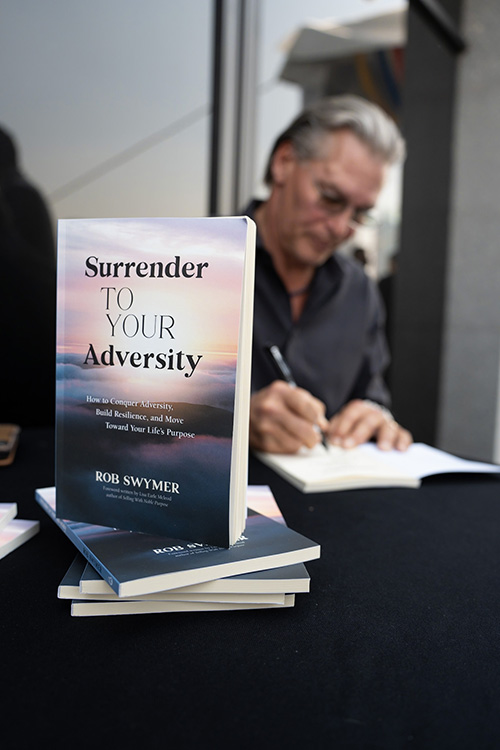 Rob Swymer signing books at Yalo speaking event